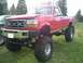 1993 Ford F-350 - This lifted Ford F-350 has massive off-road tires and a custom bumper.