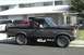1989 Ford Bronco - This 1987 Ford Bronco is parked in front of a building. A second vehicle is visible behind it.