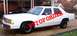 1991 Ford Crown Victoria LTD - White 1991 Ford Crown Victoria LTD sedan with 'OUT OF ORDER' stencil on the side.