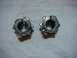 1993 Ford Bronco - Two metal hubs, possibly for a vehicle's drivetrain, are shown against a neutral background.