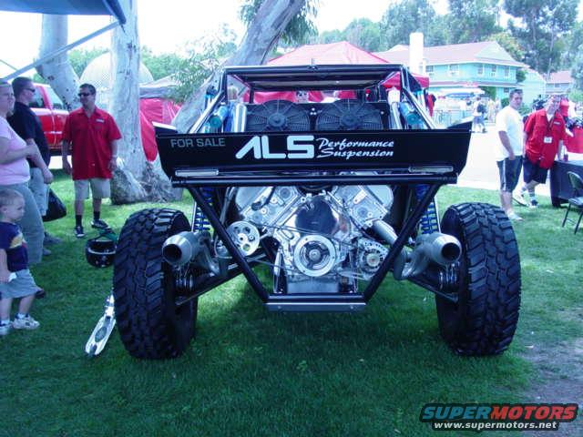 Buggy with exposed V8 engine and 'ALS Performance Suspension' on the back. It says 'FOR SALE'