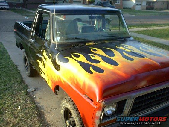 1978 Ford Bronco with flame paint job on hood and fender