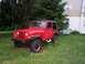 1989 Jeep YJ - This red Jeep Wrangler appears to be from the late 1980s, likely a 1987 model, based on its body style.