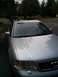 1999 Audi A6 - Front view of a silver 1999 Audi A6 sedan parked on a driveway with trees in the background.