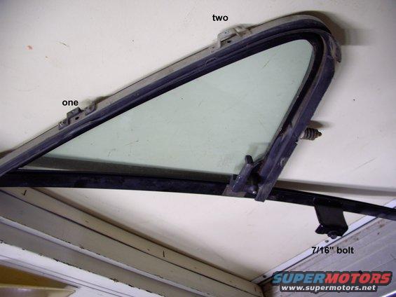 One and two note where the philips hold it on.  The 7/16" bolt is under the inner door trim panel. just be careful removing the up and down window seal.