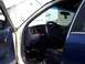1995 Ford Crown Victoria - The interior of a 1995 Ford Crown Victoria is shown with the driver's door open.