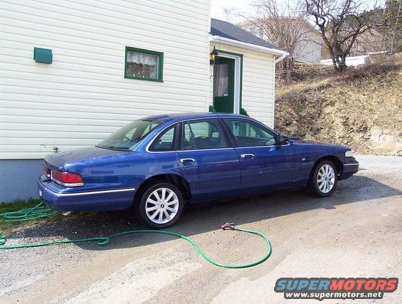 Blue 1995 Ford Crown Victoria sedan, side view