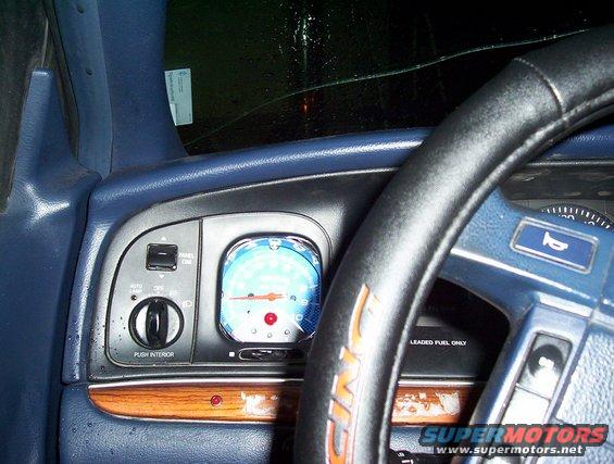 1995 Ford Crown Victoria interior showing blue dashboard, steering wheel, and instrument cluster