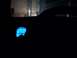 1995 Ford Crown Victoria - The interior of a vehicle at night, showing a dimly lit dashboard with a bright blue illuminated gauge.