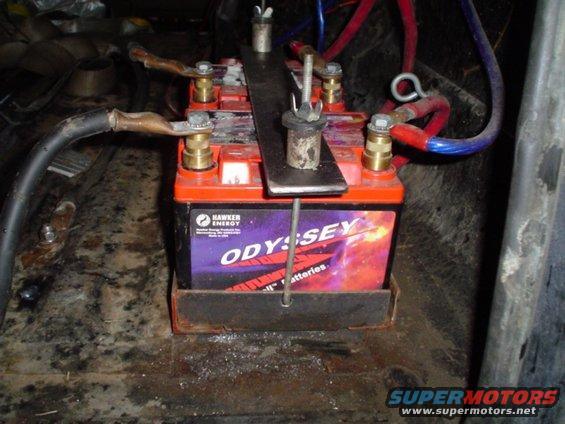 picture-102.jpg my new battery holddown, much better then a bungee cord that barely held down the aux battery I got a lot farther then I thought I was gonna... im pretty much done.
