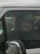 1978 Ford Bronco - Man in a vehicle gives a peace sign while wearing a hat with '2007' on it.