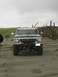 1978 Ford Bronco - A 1978 Ford Bronco is parked on a sandy beach under an overcast sky.