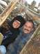 1978 Ford Bronco - A couple smiles for the camera while within a rustic driftwood shelter on the coast.