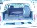 1989 Ford Bronco - Rear cargo area of a 1989 Ford Bronco, spare tire mounted inside.