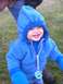 1978 Ford Bronco - A happy child wearing a blue hooded sweatshirt and mittens smiles while outdoors on a grassy area.