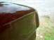 1990 Ford F-150 - Detail of a car's body panel, showing the curvature of the hood near the corner.