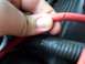 1995 Ford Crown Victoria - A close-up shows a red wire with a visible cut.
