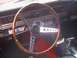 1966 Ford Fairlane - Interior view of a 1966 Ford Fairlane, a wood-rimmed steering wheel and original dashboard.