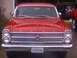 1966 Ford Fairlane - Front view of a red 1966 Ford Fairlane, a prominent chrome grille and dual headlights.
