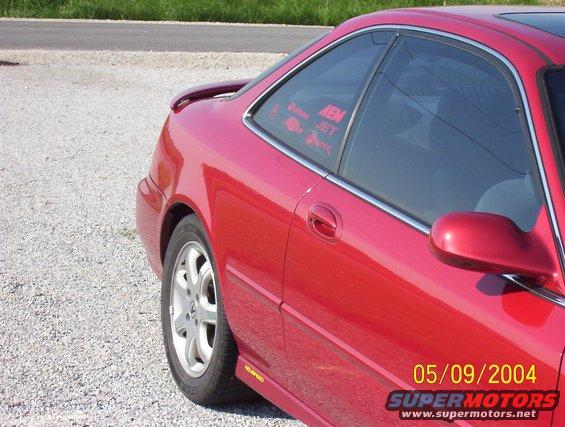 100_0618.jpg a picture of the stickers my cousin has on his car