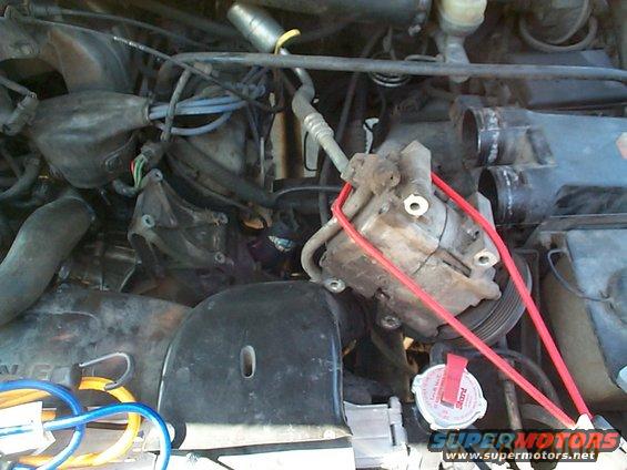dcp01285.jpg Once all of the bolts are removed use a bungee cord to hold the compressor out of the way. The bracket is now easily accessable.