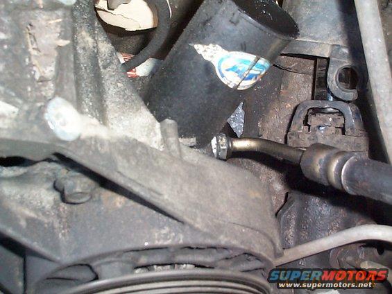 dcp01288.jpg Next I'll remove the high pressure line from the pump and then the gear box. My old C2 pump was really beat up. The plastic pulley was even chipped as was the top part of the resevoir.