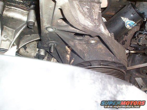 dcp01294.jpg Now you can remove the bolts from the pump bracket, there are 3 bolts and one nut.