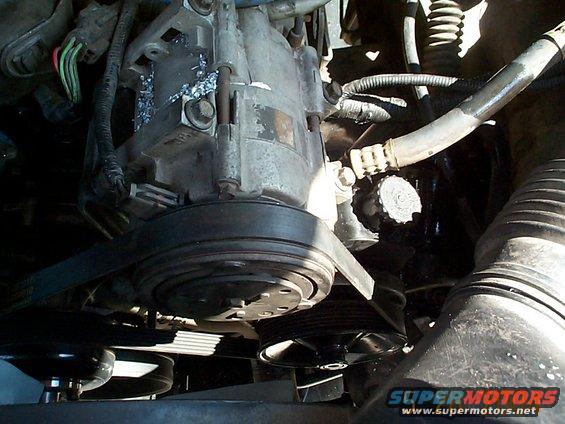 dcp01313.jpg Reinstall the serpentine belt. I put the stock one on but it felt to tight so I stepped up one size. Don't forget to add powersteering fluid.