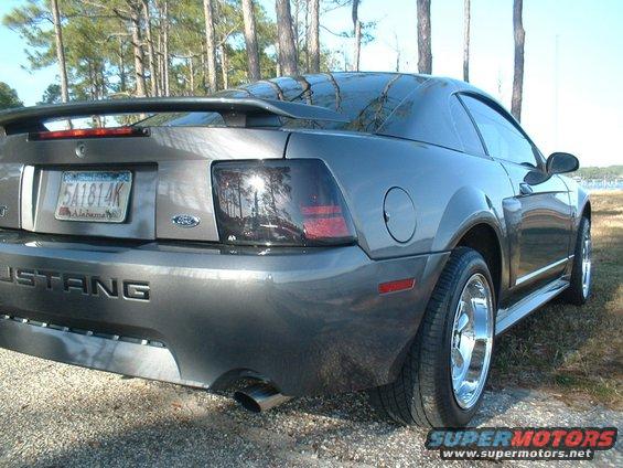 2003 Ford Mustang rear quarter panel, bumper, and taillight. Alabama license plate 5A1814K