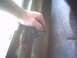 1991 Ford Crown Victoria - Close-up of a hand manipulating a small, complex metal part.