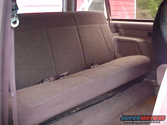 1992 Ford Bronco interior with brown fabric rear bench seat and seatbelt