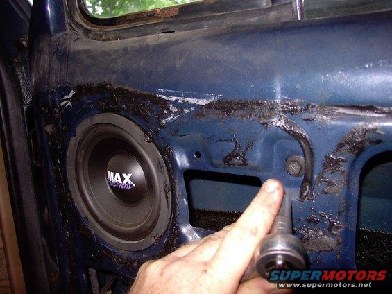 img_0178.jpg This one 7/16" bolt holds the corner window frame to the door.