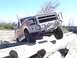 1982 Ford Bronco - This Ford F-Series truck navigates an obstacle course of logs on a sandy terrain.