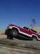 1982 Ford Bronco - This 1982 Ford Bronco is navigating an obstacle course made of logs on a beach.