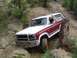 1982 Ford Bronco - This 1982 Ford Bronco is tackling a challenging off-road course with steep inclines and rocky terrain.