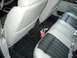 1996 Chevrolet Impala - The interior of a car shows two-tone seats and a custom floor mat with a racing-themed logo.