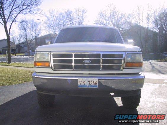 White Ford Bronco front view with chrome grille and Illinois license plate 519 3246