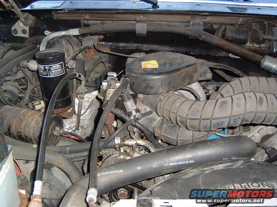 Engine bay with air intake hoses and filter housing