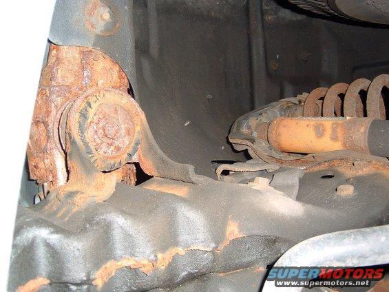 rusted suspension parts, shock absorber, and coil spring