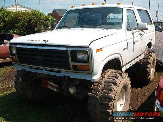 White Ford Bronco with lifted suspension and oversized off-road tires