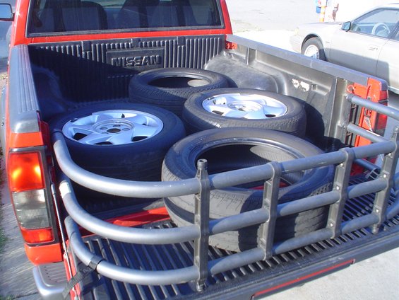dsc03784.jpg The old tires and bad wheels, ready to be sent out for mounting