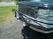 1994 Ford Bronco - Front view of a 1992 Ford Bronco, showing the grille and custom bumper with lights.