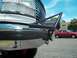1994 Ford Bronco - A red sedan is parked behind a 1992 Ford Bronco at an outdoor lot.