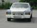 1992 Ford Crown Victoria - This sedan features a prominent decal on its front grille reading 'Hell Bombers Austria'.