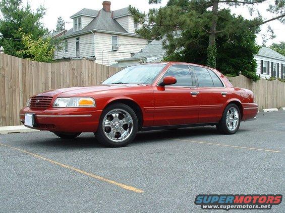 Red 1998 Ford Crown Victoria sedan, 3/4 front view