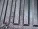1990 Ford Bronco - The textured surface of a truck bed liner shows raised ribs and a speckled finish.