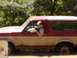 1979 Ford Bronco II - A two-door SUV, likely a 1978 Ford Bronco, is seen from the side with a driver inside.