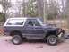 1988 Ford Bronco - 5 min after accidentally moving garage off foundation lucky the hood was off just need a fender