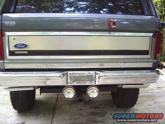 Rear view of 1986 Ford Bronco tailgate with Ford emblem and dual exhaust