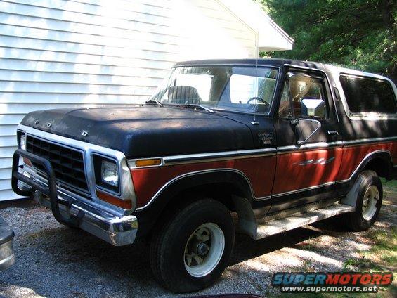 Black and red Ford Bronco parked outside a house. It has a bull bar on the front